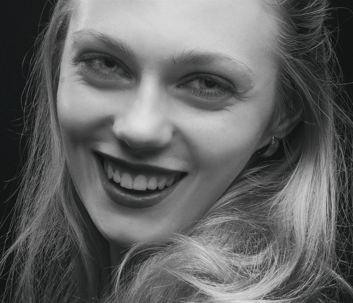 Close-up of a bright, healthy smile in black and white